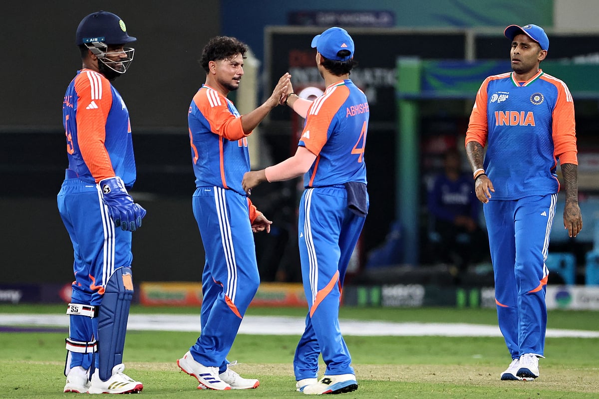India's players celebrate after the dismissal of UAE's Harshit Kaushik during the Asia Cup 2025 Twenty20 international cricket match between United Arab Emirates and India at the Dubai International Stadium in Dubai on 10 September, 2025