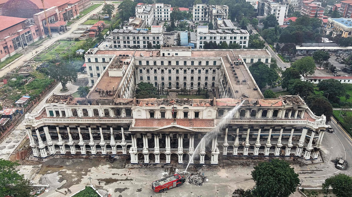 An aerial view shows firefighters dousing the torched Singha Durbar, the main administrative building for the Nepal government, a day after it was set ablaze by protesters in Kathmandu on 10 September, 2025