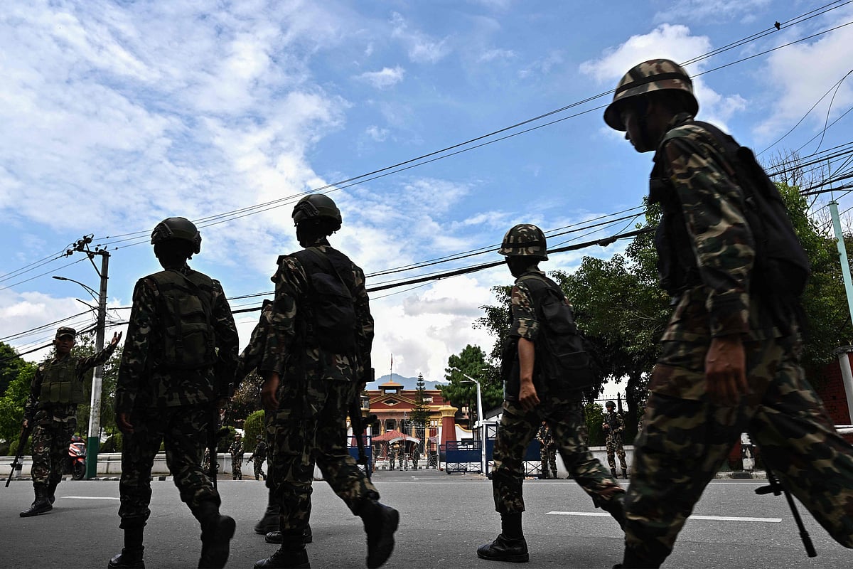 Army personnel patrol outside Nepal’s President House during a curfew imposed to restore law and order in Kathmandu on 12 September 2025. The army has imposed a curfew in the Himalayan nation of 30 million people, with soldiers patrolling the largely quiet streets after the worst violence in two decades
