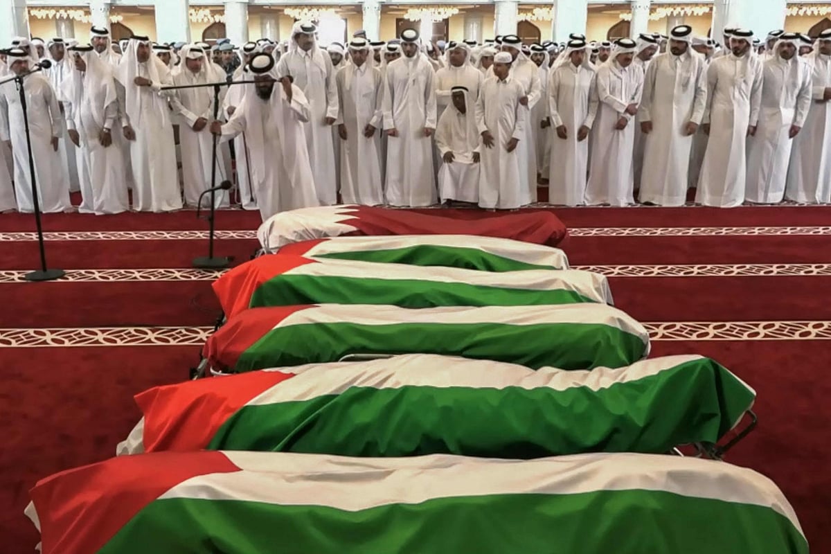 This grab from footage released by Qatar TV shows Qatar's Emir Sheikh Tamim bin Hamad Al-Thani attends the funeral of people killed in an Israeli strike on figures of the Palestinain Hamas movement two days earlier, at Sheikh Mohammed bin Abdul Wahhab Mosque in Doha on 11 September 2025.