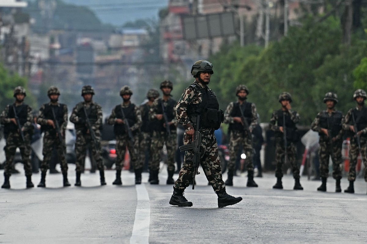 Nepal's army soldiers take their positions to disperse the protesters in front of the President House during a curfew imposed to restore law and order, in Kathmandu on 12 September, 2025.