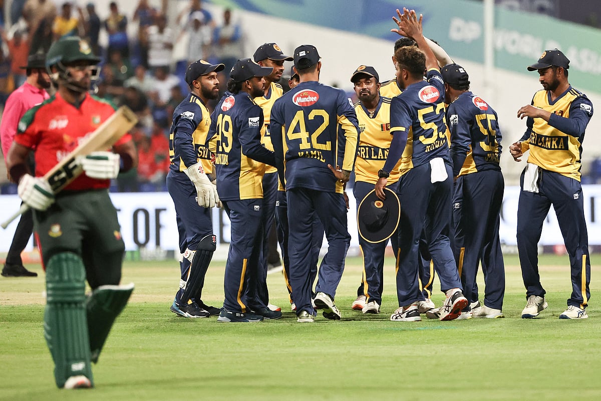 Sri Lanka's players celebrate after the dismissal of Bangladesh's Parvez Hossain Emon during the Asia Cup 2025 Twenty20 international cricket match between Bangladesh and Sri Lanka at the Sheikh Zayed Cricket Stadium in Abu Dhabi on 13 September, 2025.
