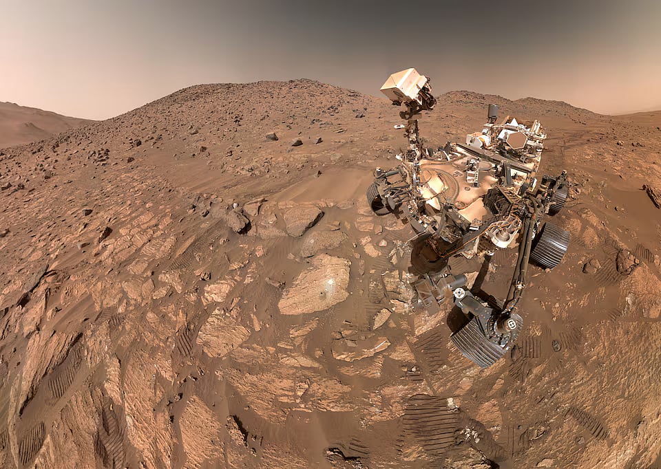A "selfie" taken by NASA's Perseverance Mars rover, made up of 62 individual images, on 23 July, in this image released on 10 September, 2025. A rock nicknamed "Cheyava Falls," which has features that may bear on the question of whether the Red Planet was long ago home to microscopic life, is seen to the left of the rover near the center of the image.