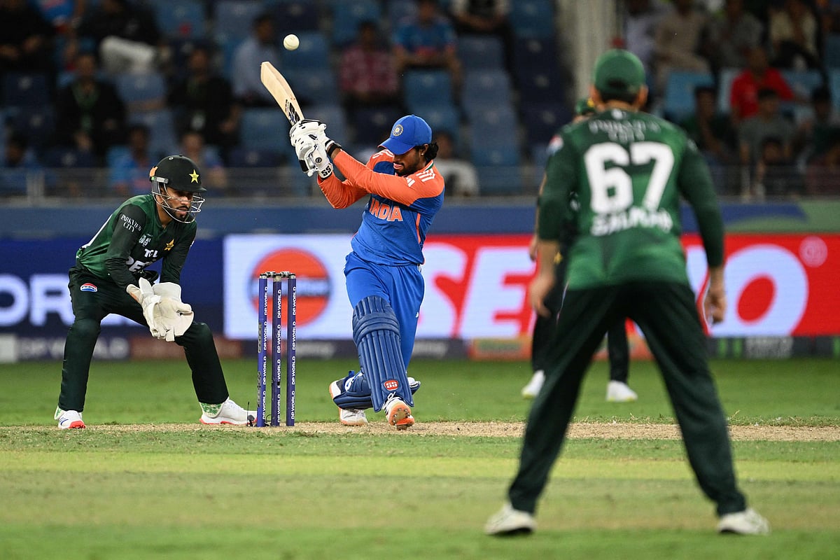 India’s Tilak Varma (C) plays a shot during the Asia Cup 2025 Twenty20 international cricket match between India and Pakistan at the Dubai International Stadium in Dubai on 14 September 2025
