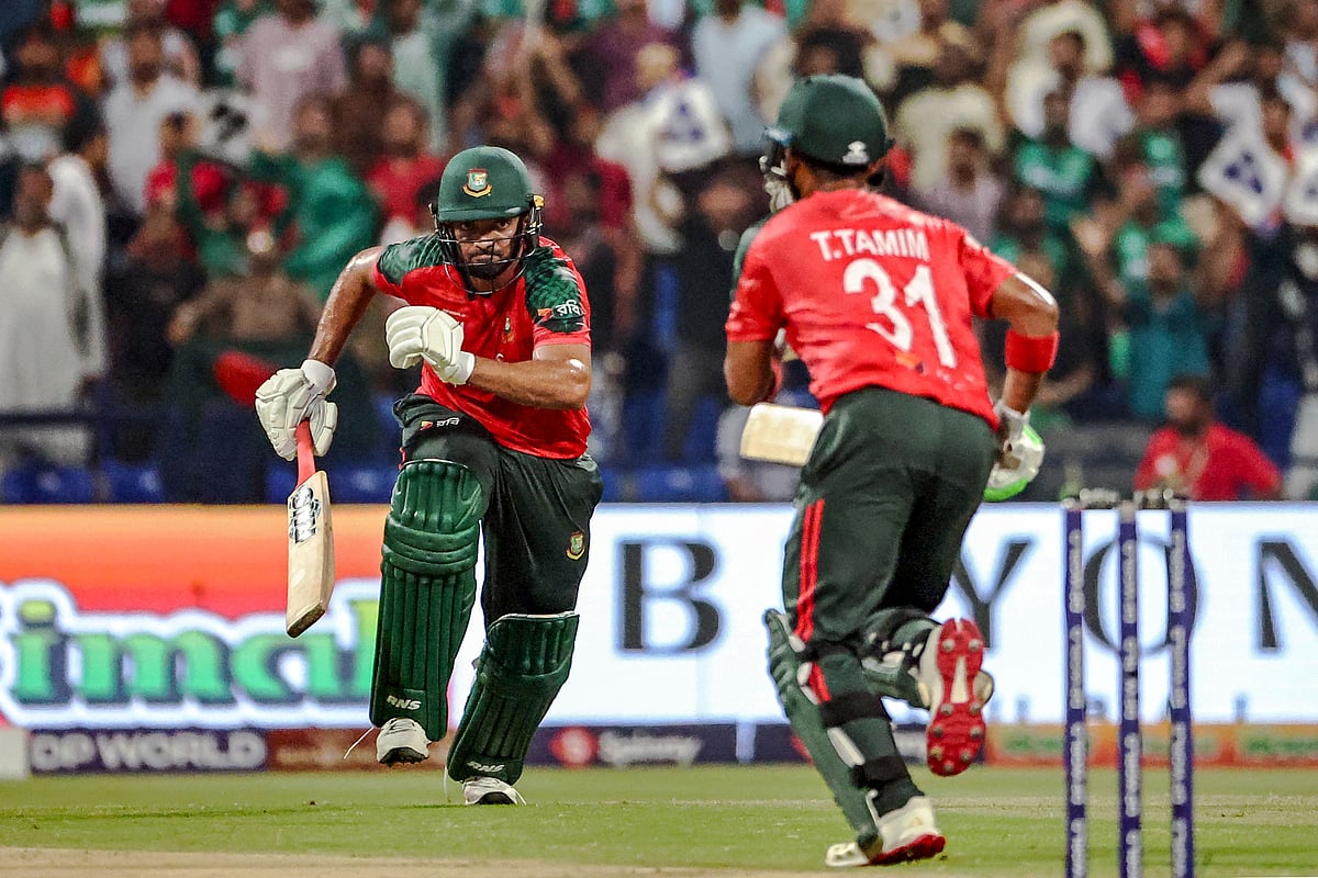 Bangladesh’s Saif Hassan (L) and Tanzid Hasan run between the wickets during the Asia Cup 2025 Twenty20 international cricket match between Afghanistan and Bangladesh at the Sheikh Zayed Cricket Stadium in Abu Dhabi on 16 September 2025