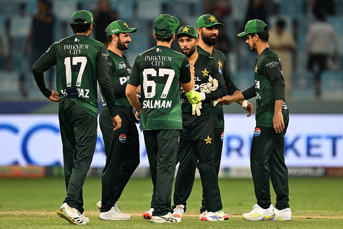 Pakistan's players celebrate their win at the end of the Asia Cup 2025 Twenty20 international cricket match between United Arab Emirates and Pakistan at the Dubai International Stadium in Dubai on 17 September, 2025