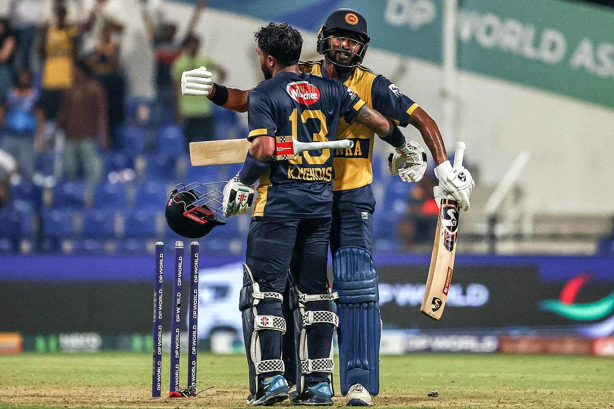 Sri Lanka's Kusal Mendis (front) and Kamindu Mendis celebrate their team's win in the Asia Cup 2025 Twenty20 international cricket match between Afghanistan and Sri Lanka at the Sheikh Zayed Cricket Stadium in Abu Dhabi on 18 September, 2025.