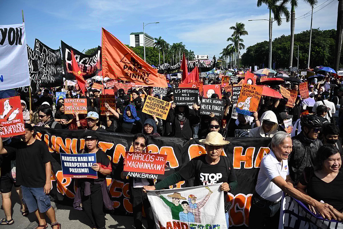 Protesters take part in a rally as they demonstrate against phony flood control projects, one of the country's biggest corruption scandals in decades, in Manila on 21 September, 2025