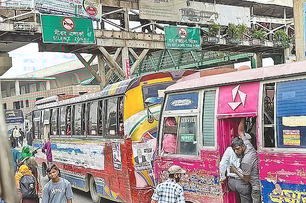 The signs above says 'silent zone', but the road below is resounds with deafening horns