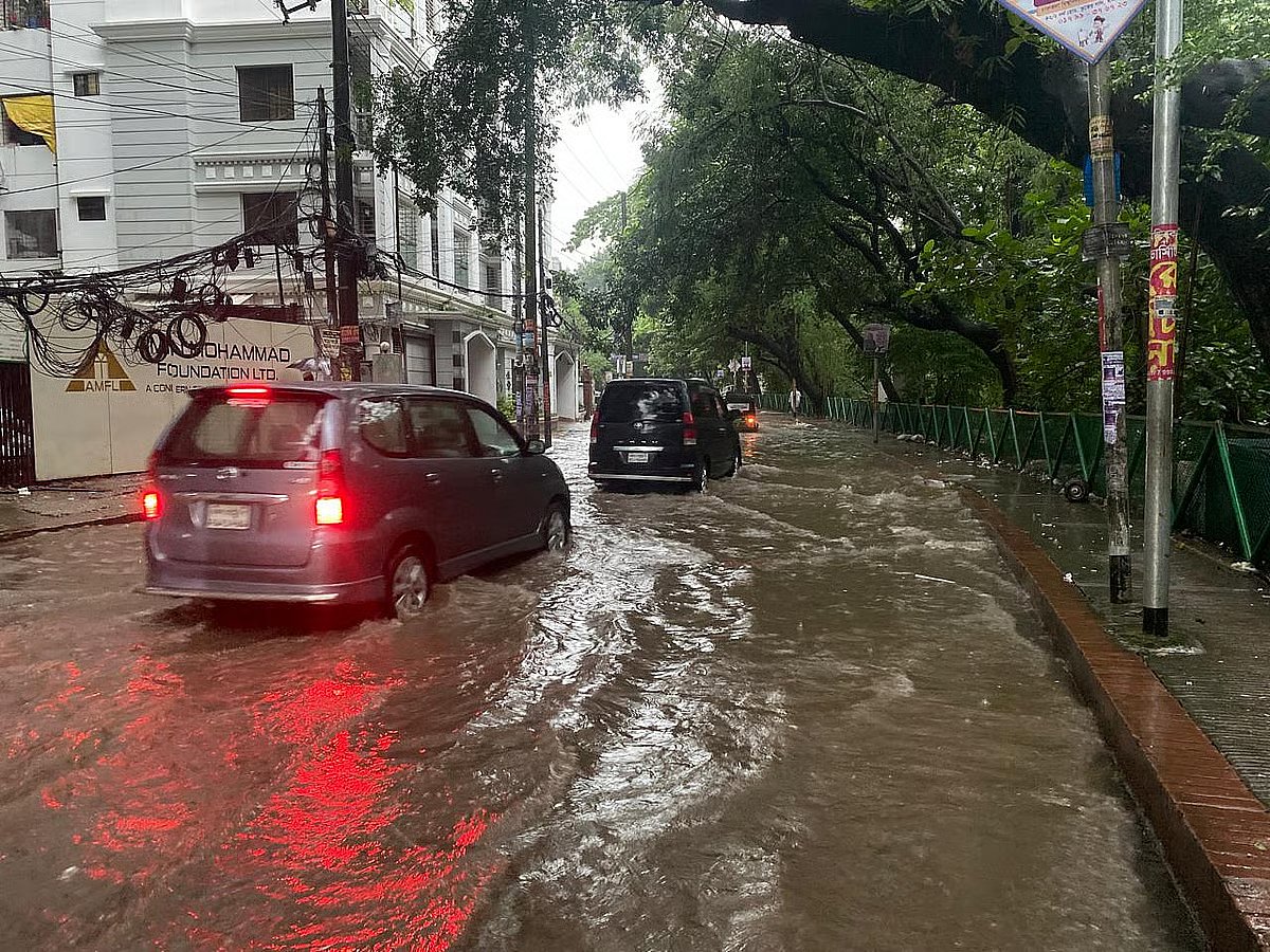 Vehicles wade through water in Kalabagan area due to heavy downpour on 22 September
