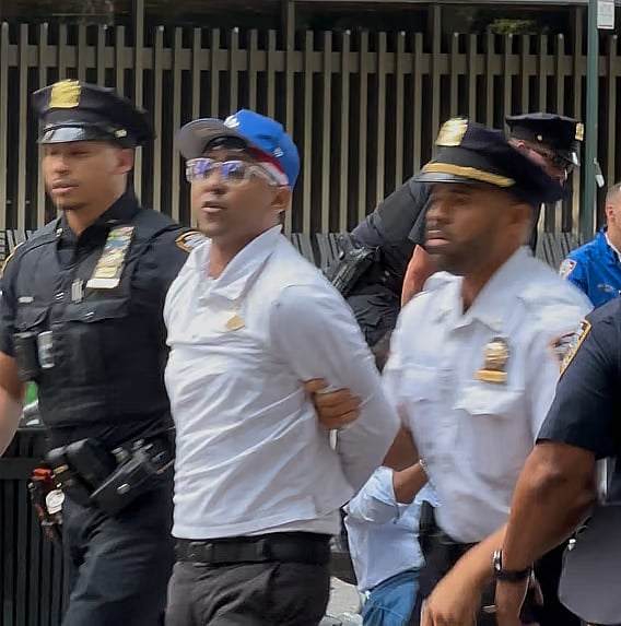 US police are seen escorting BNP activist Riaz Rahman Hossain in New York, USA.