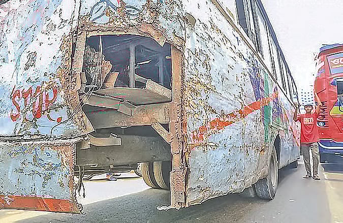 A dilapidated, faded and worn-out bus on Dhaka's roads
