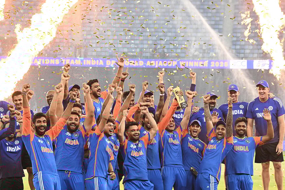 Indian team members celebrate their vicotry at the end of the Asia Cup 2025 Twenty20 international cricket final match between India and Pakistan at the Dubai International Stadium in Dubai on 28 September, 2025.