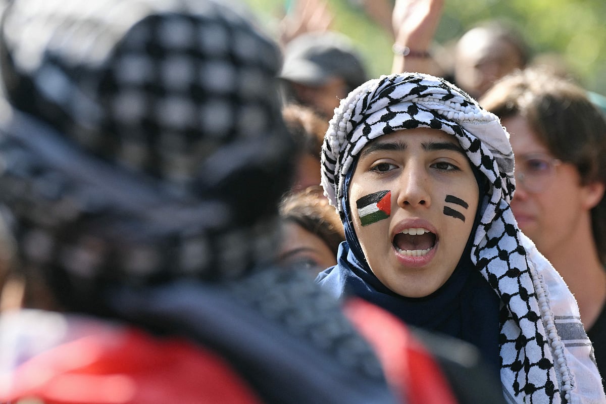 Pro-Palestinian demonstrator shouts slogans to support the Palestinians and to protest against the interception of the Global Sumud Flotilla, in Milan on October 3, 2025.