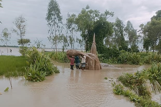 Floodwaters from the swelling Teesta River have inundated areas in Dahagram Union of Patgram upazila.