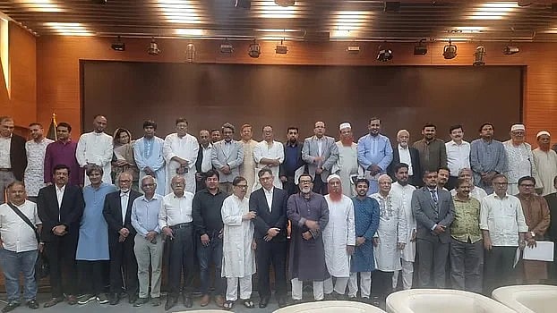 Leaders of various political parties pose for a photograph following discussions with the National Consensus Commission on at the Foreign Service Academy on Wednesday