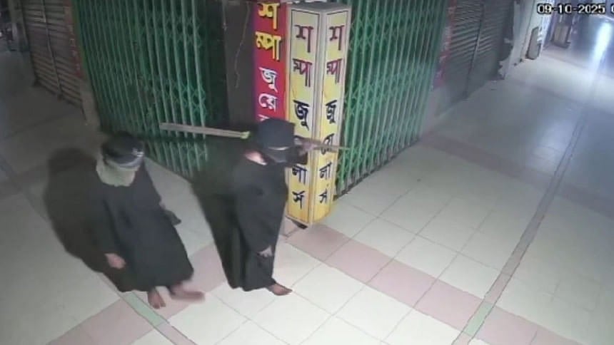 CCTV footage shows two members of the gang, wearing burqas, cutting the lock of the shop before making off with the gold ornaments.