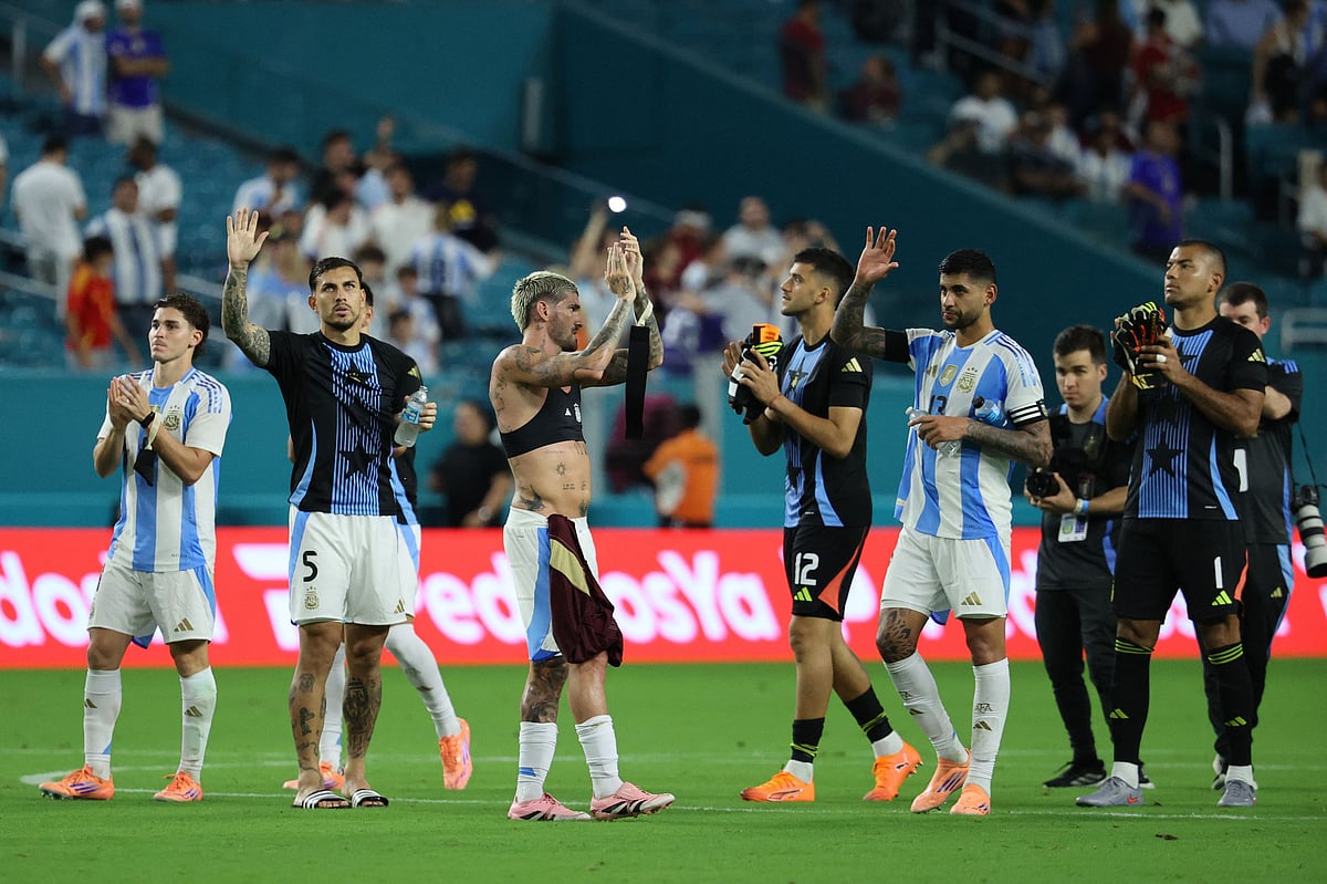 Leandro Paredes, Rodrigo De Paul, Cristian Romero of Argentina acknowledge the fans after the International Friendly between Argentina and Venezuela at Hard Rock Stadium on 10 October 2025 in Miami Gardens, Florida.