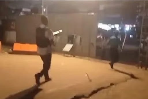 During a concert at the GEC Convention Centre in Chattogram, a clash broke out between two groups, prompting the police to disperse the crowd gathered in front of the auditorium gate. At that moment, a person wearing a vest was seen advancing with a firearm in hand.