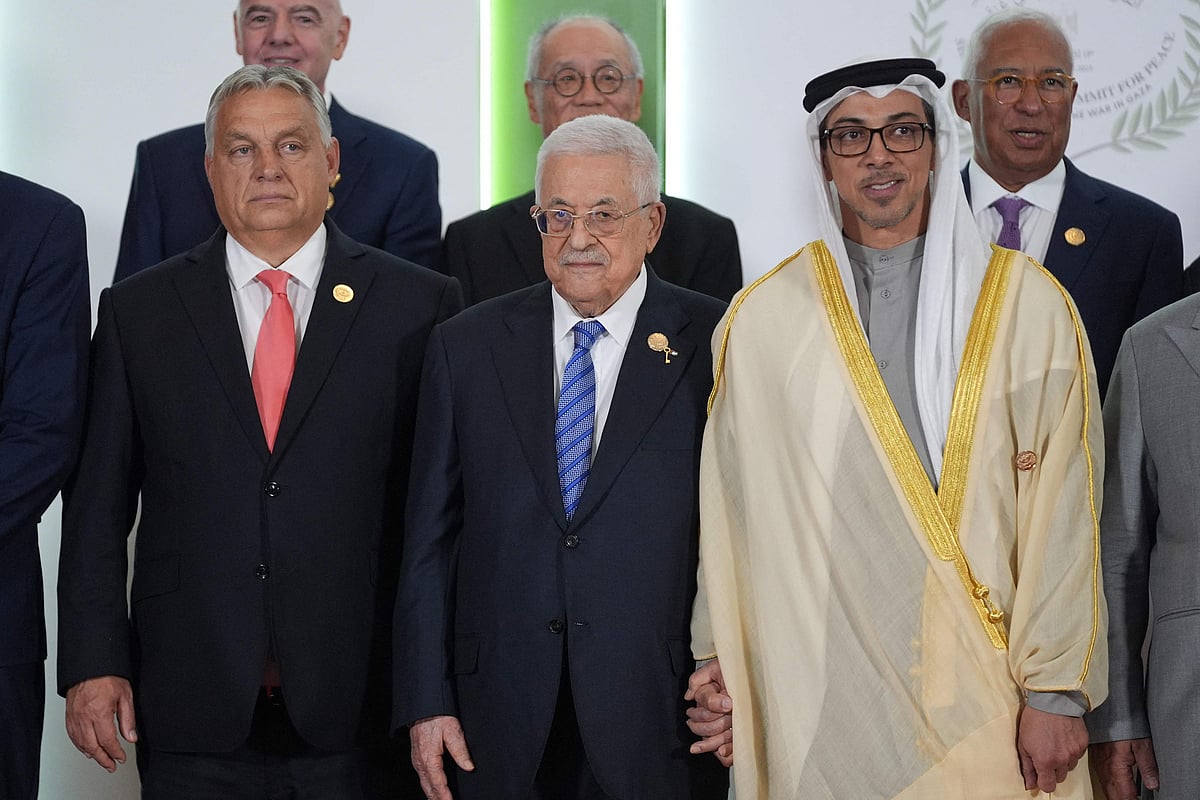 Hungary's Prime Minister Viktor Orban, Palestinian President Mahmoud Abbas and United Arab Emirates Vice President and Deputy Prime Minister Sheikh Mansour bin Zayed al-Nahyan pose for a group picture alongside participating leaders at the Gaza summit in Sharm El-Sheikh on 13 October, 2025