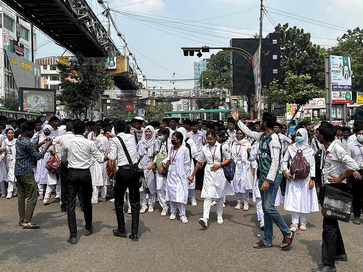 Protesting higher secondary students of Dhaka College lift the road blockade at the Science Laboratory intersection in Dhaka on 14 October 2025
