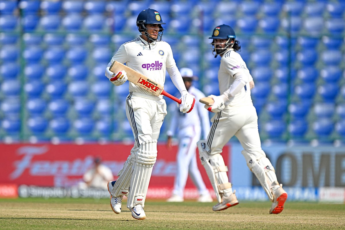 India's KL Rahul (R) and captain Shubman Gill (L) run between the wickets during the fifth day of the second and last Test cricket match between India and West Indies at the Arun Jaitley Stadium in New Delhi on 14 October, 2025.