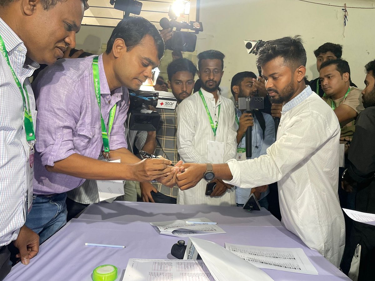 At the Faculty of Information Technology, Chhatra Dal panel’s Vice President (VP) candidate Sajjad Hossain Hridoy has his finger marked with ink after casting his vote.
