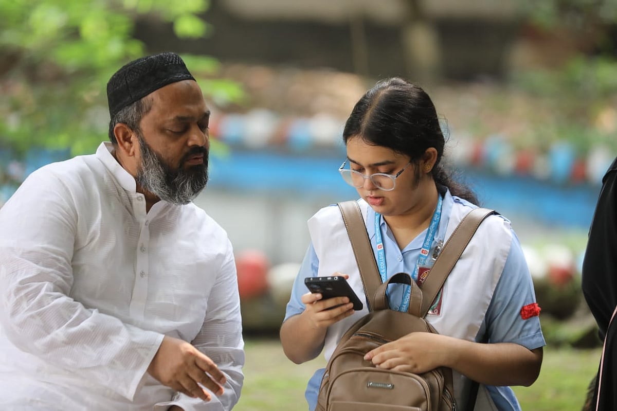 A student checks her HSC result in mobile phone on 16 October 2025