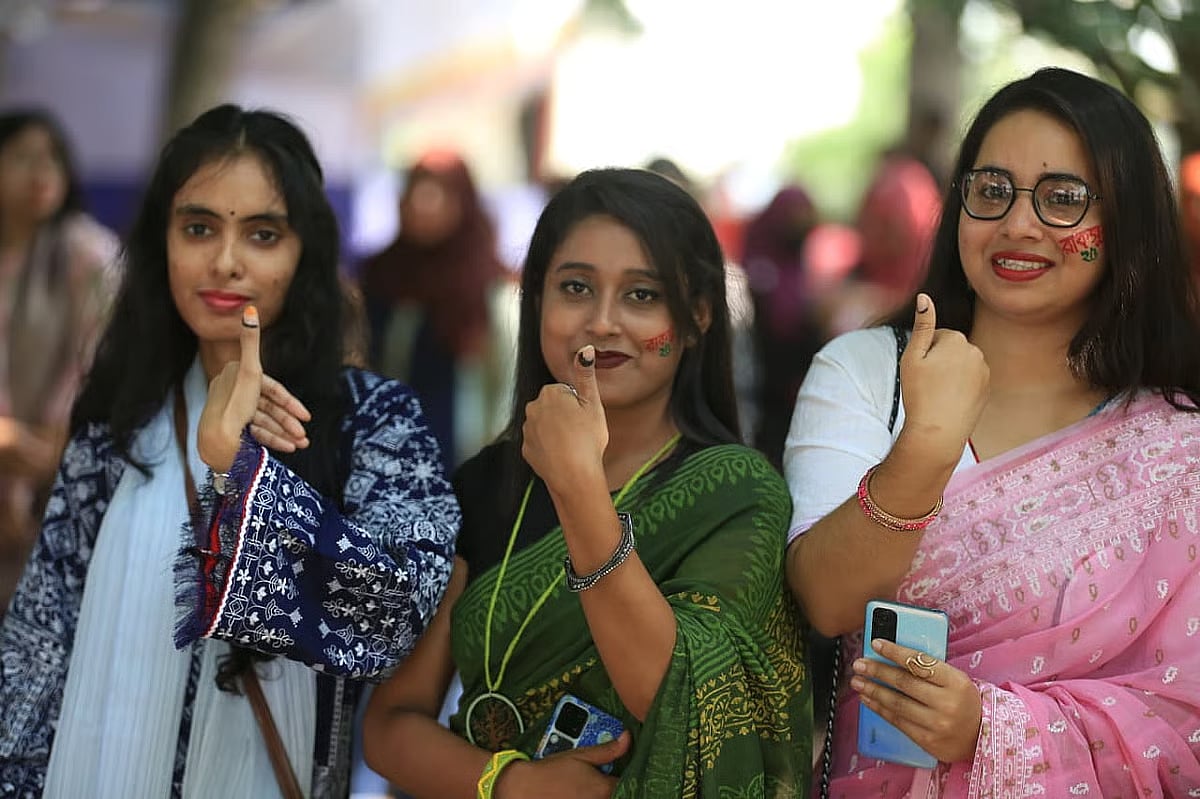 Female student voters show their marked fingers after casting ballot in the RUCSU election on Khaleda Zia hall premises of Rajshahi University on 16 October 2025.