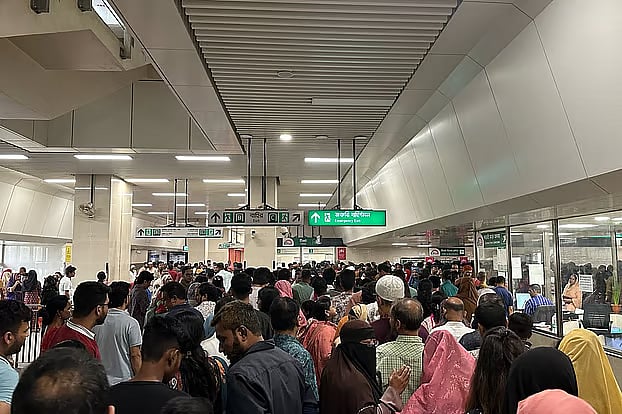 Long queues for Metro Rail tickets. Dhaka, 13 April