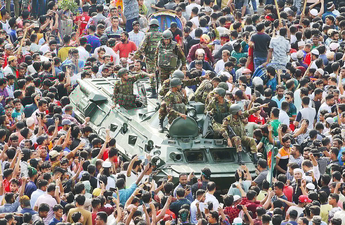 Army members among the delighted people after the fall of Sheikh Hasina and the Awami League government on 5 August 2024