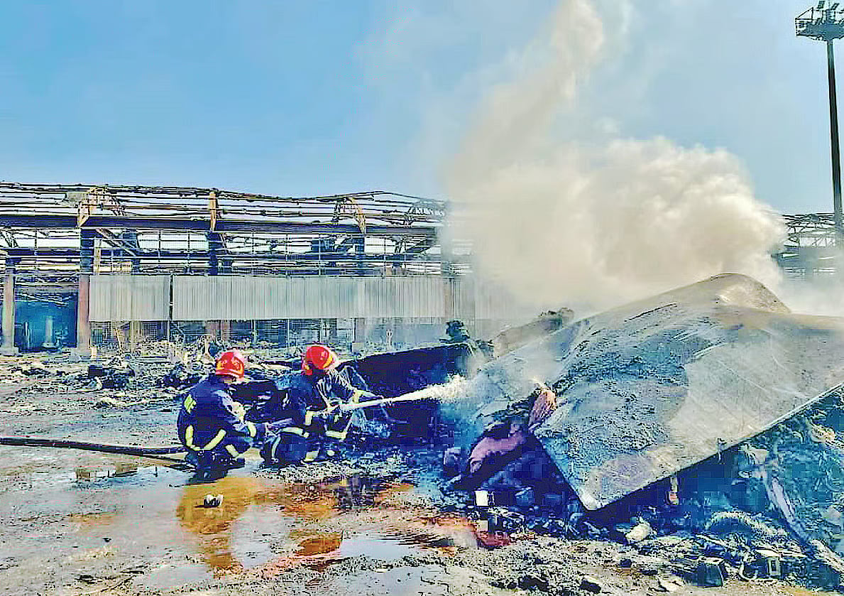 Firefighters trying to douse small fires after bringing the main fire at cargo village of Hazrat Shahjalal International Airport under control on the second day, on 19 October 2025