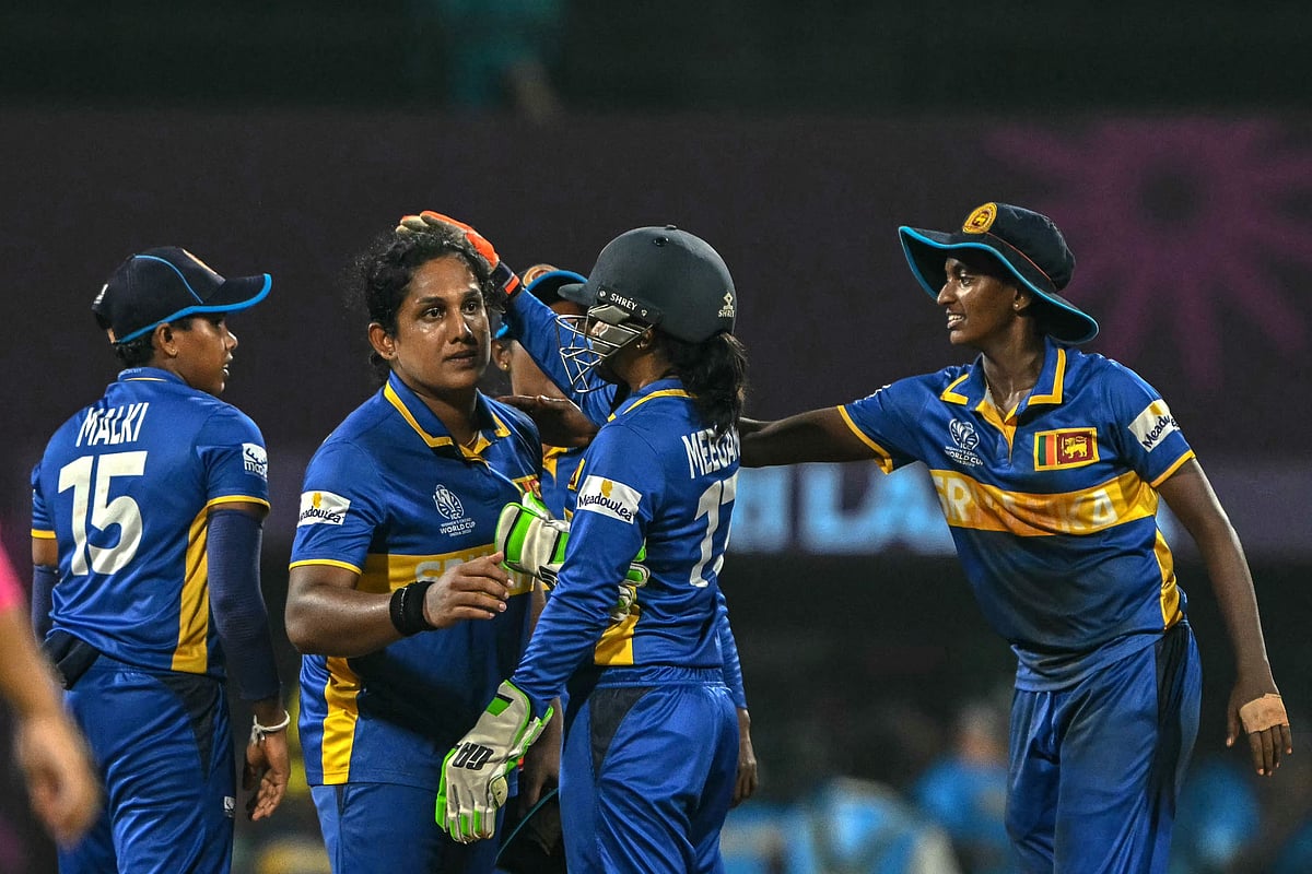 Sri Lanka's captain Chamari Athapaththu (2L) and her teammates celebrate after their team's win in the ICC Women's Cricket World Cup 2025 one-day international (ODI) match between Sri Lanka and Bangladesh at the DY Patil Stadium in Navi Mumbai on October 20, 2025