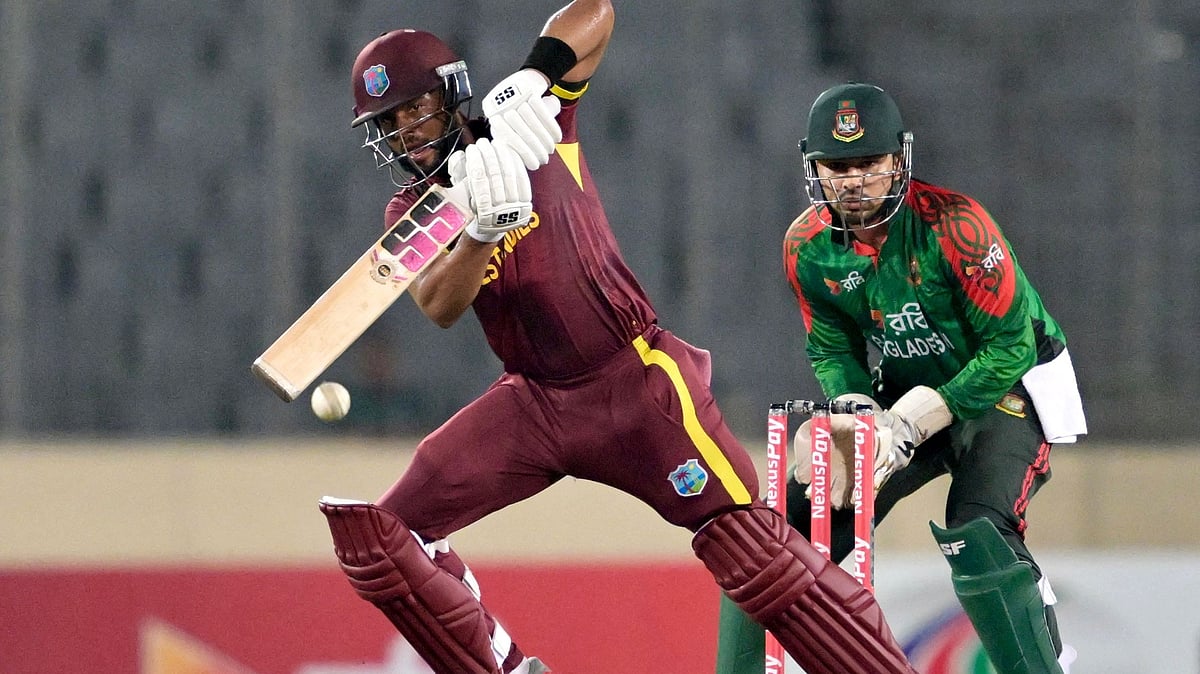 West Indies' captain Shai Hope (L) plays a shot as Bangladesh's wicketkeeper Nurul Hasan watches during the second one-day international (ODI) cricket match between Bangladesh and West Indies at the Sher-e-Bangla National Cricket Stadium in Dhaka on 21 October, 2025
