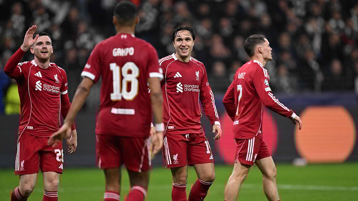 Liverpool's Dutch striker #18 Cody Gakpo (2nd L) celebrates scoring the 1-4 goal with his teammates