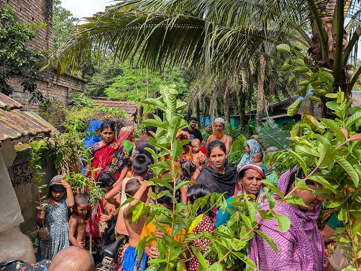 Bangladesh's first carbon-neutral child Ayaan Khan's parents have planted 580 trees in Satkhira. Villagers are seen taking the saplings to plant.