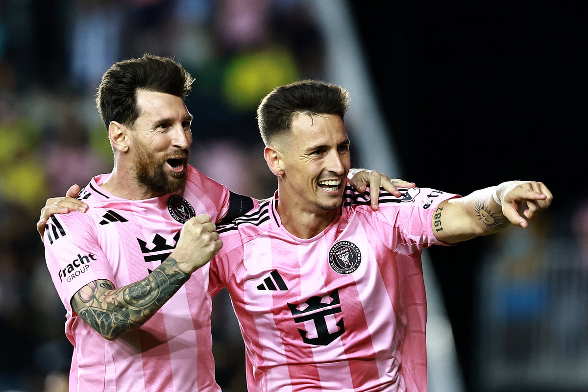 Tadeo Allende #21 of Inter Miami CF celebrates after scoring the team's second goal with teammate Lionel Messi #10 during the 2025 MLS Cup Playoff match between Inter Miami CF and Nashville SC at Chase Stadium on 24 October, 2025 in Fort Lauderdale, Florida.