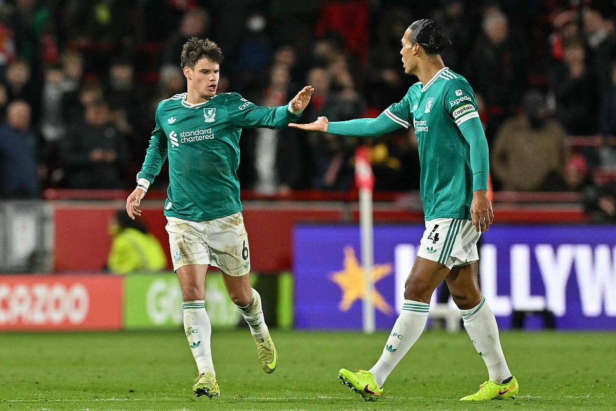 Liverpool's Hungarian defender #06 Milos Kerkez (L) celebrates with Liverpool's Dutch defender #04 Virgil van Dijk (R) after scoring their first goal for 2-1 during the English Premier League football match between Brentford and Liverpool at the Gtech Community Stadium in London on 25 October, 2025.