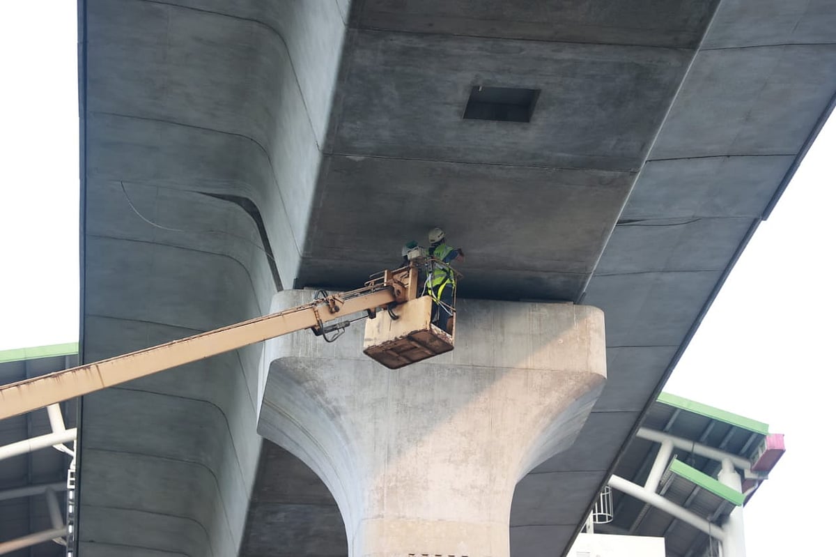 Repairing work of the bearing pad of the metro rail is underway near Farmgate metro station in Dhaka on 26 October 2025