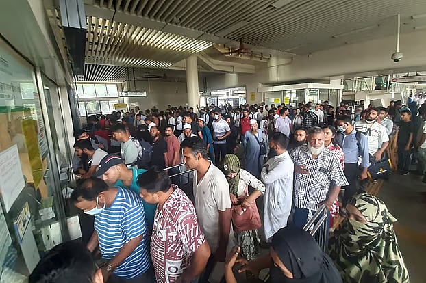Crowds of passengers seen buying tickets after metro rail services resumed at Agargaon Station, Dhaka.
