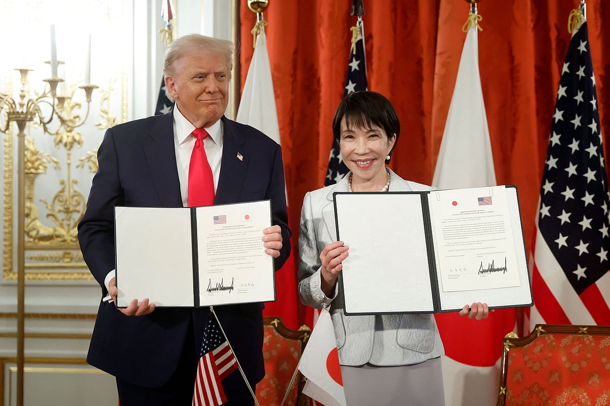 US President Donald Trump and Japan's Prime Minister Sanae Takaichi pose during a signing ceremony for a document on the implementation of the US-Japan trade deal at the Akasaka State Guest House in Tokyo on 28 October, 2025.
