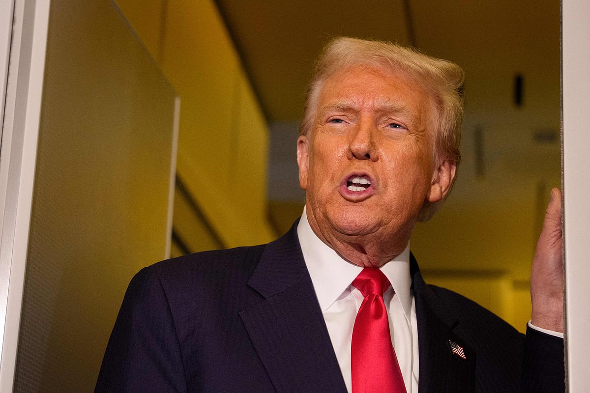 US President Donald Trump and US Trade Representative Jamison Greer speaks to members of the media aboard Air Force One on 30 October, 2025 in flight.