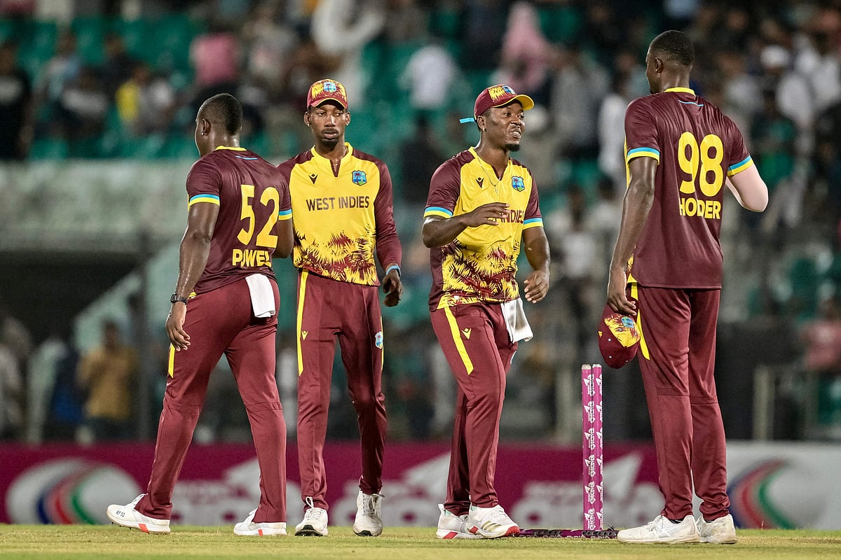 West Indies' players celebrate their team's win at the end of the second Twenty20 international cricket match between Bangladesh and West Indies at the Bir Sreshtho Flight Lieutenant Matiur Rahman Stadium in Chittagong on 29 October 2025