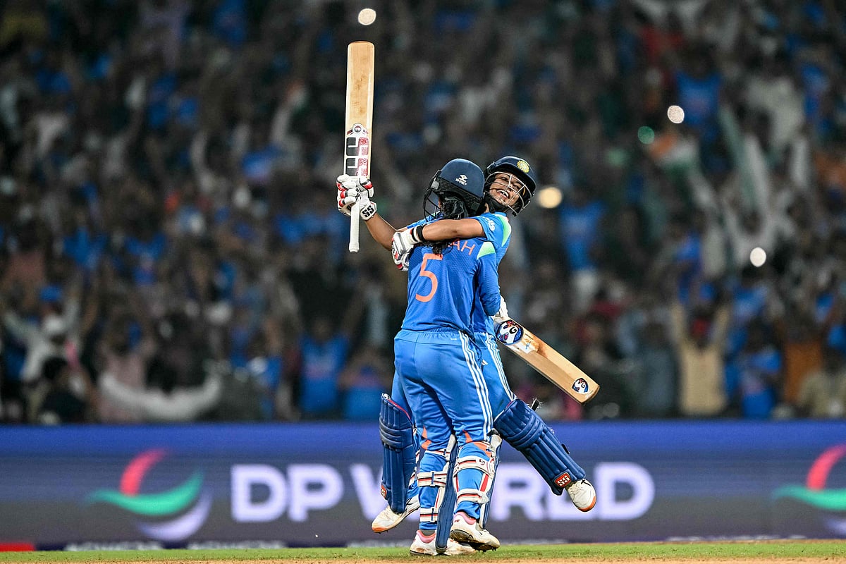 India's Jemimah Rodrigues (front) and Amanjot Kaur celebrate their team's win at the end of the ICC Women's Cricket World Cup 2025 one-day international (ODI) semi-final match between India and Australia at the DY Patil Stadium in Navi Mumbai on 30 October, 2025.