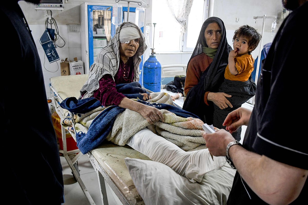 An Afghan injured woman receives treatment at a hospital in the aftermath of an earthquake, that struck overnight in Mazar-i-Sharif on 3 November, 2025.