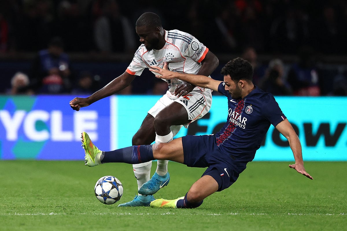 Paris Saint-Germain’s Portuguese forward #09 Goncalo Ramos (R) tackles Bayern Munich’s French defender #02 Dayot Upamecano during the UEFA Champions League, league phase day 4, football match between Paris Saint-Germain (PSG) and FC Bayern Munich at the Parc des Princes in Paris, on 4 November 2025