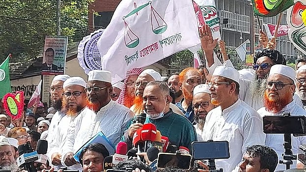 Jamaat-e-Islami Nayeb-e-ameer Syed Abdullah Mohammad Taher addresses a rally held before Jamaat’s protest procession in the city’s Paltan intersection area today, Thursday.