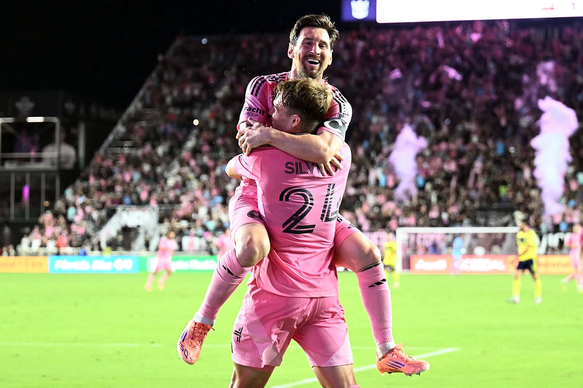 Inter Miami's Argentine forward #10 Lionel Messi celebrates scoring his second goal with Argentine midfielder #24 Mateo Silvetti during the Major League Soccer (MLS) playoff football match between Inter Miami and Nashville SC at Chase Stadium in Fort Lauderdale, Florida on 8 November, 2025.
