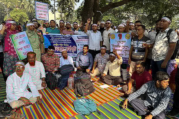 Government primary school teachers stage a continuous sit-in at the Central Shaheed Minar in Dhaka. 9 October 2025.