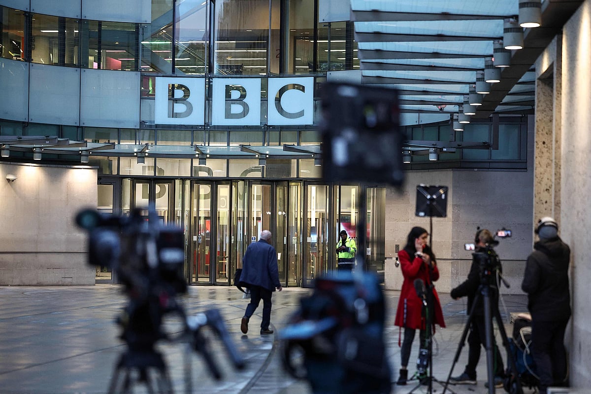 Members of the media wait outside the entrance to the offices of the BBC in London on 10 November, 2025.
